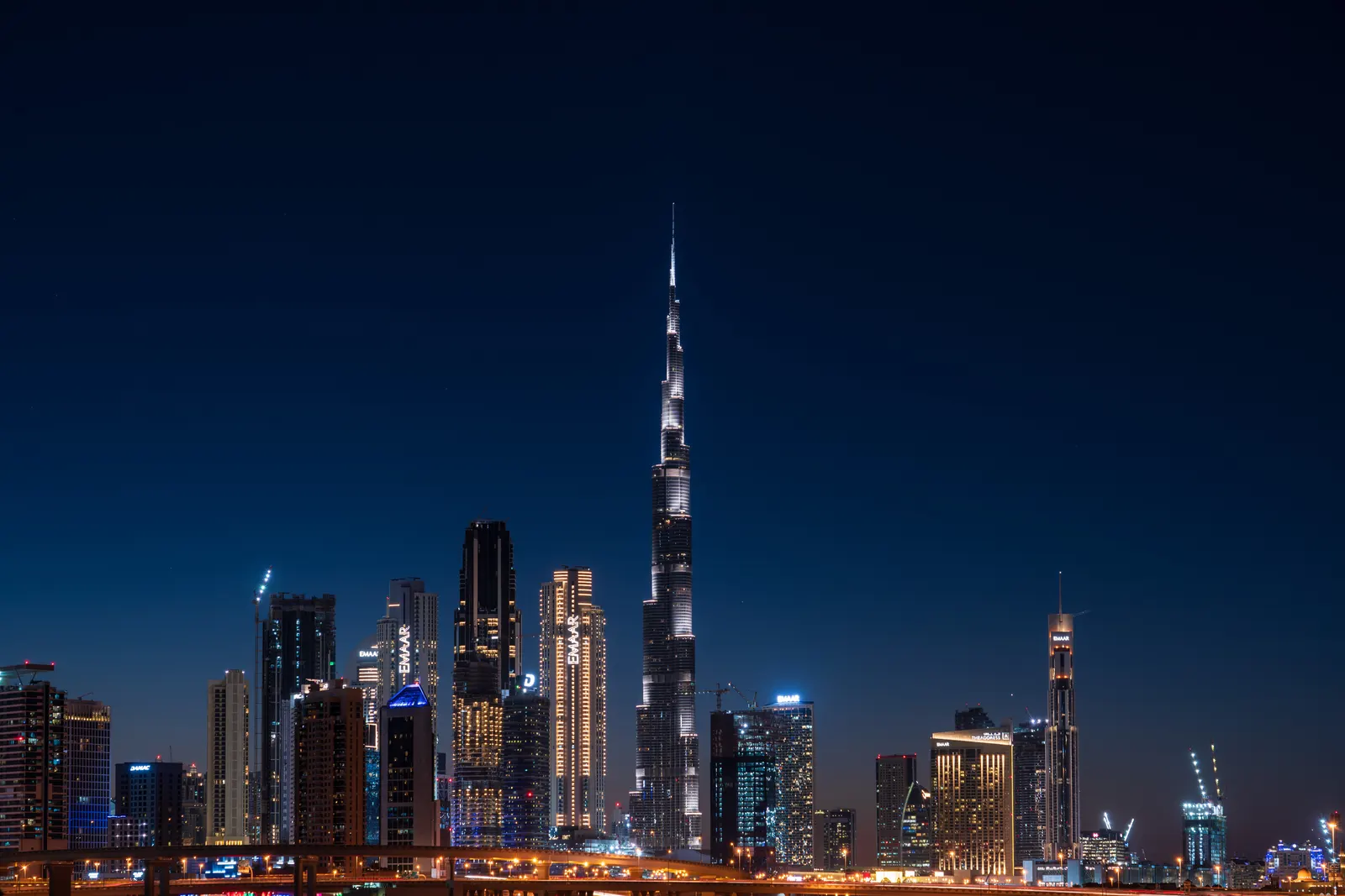 The Burj Khalifa lit up over Dubai at night